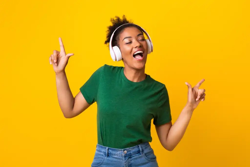 happy singing winning shutterstock 1761880700 young woman dancing